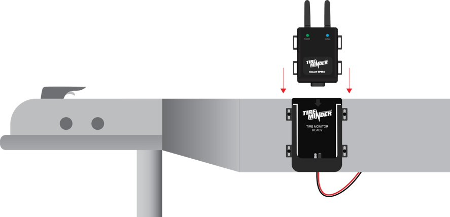 TPMS module sliding into vertically mounted bracket on trailer frame